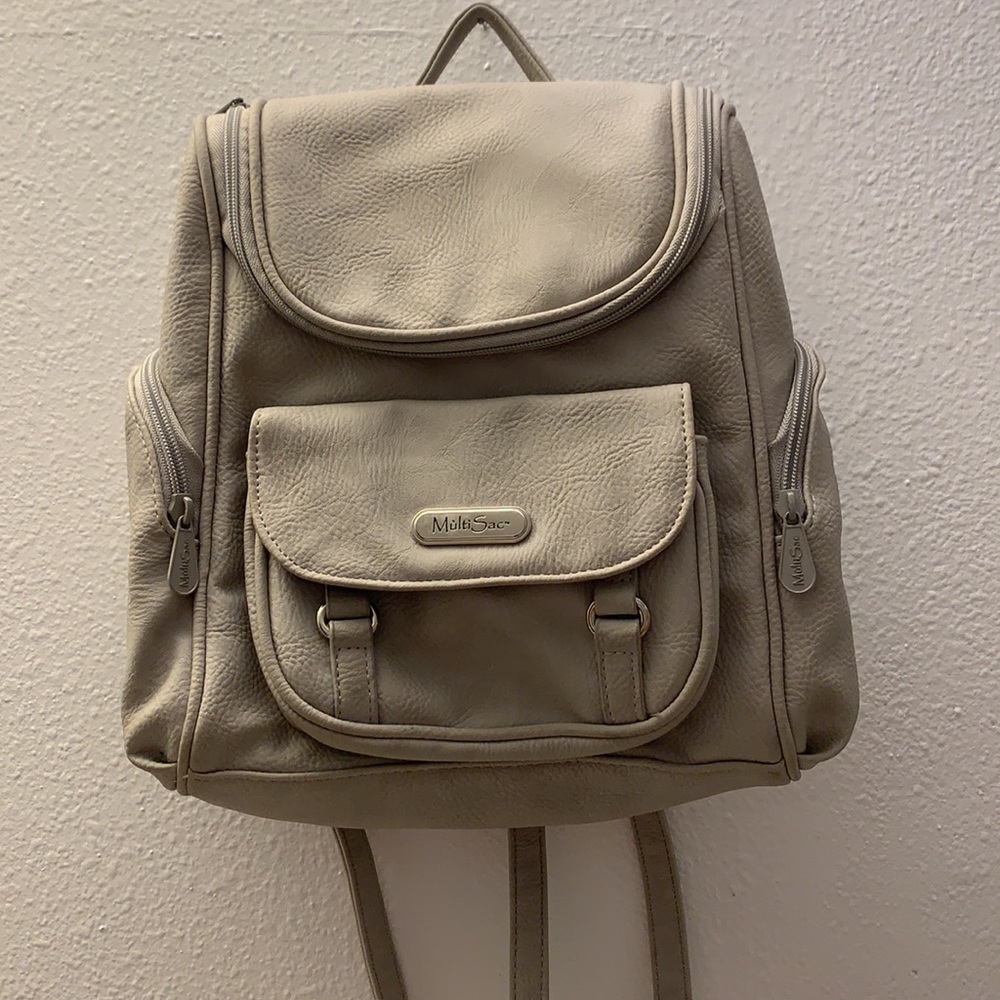 MultiSac handbag/backpack in tan PU leather,10”X12” with 8 pockets